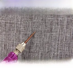 Detail of gray scratch-resistant and wear-resistant fabric texture for sling bag