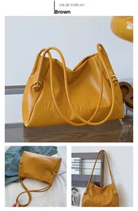Primer plano detallado del bolso tote de cuero marrón con logotipo grabado y asa anudada