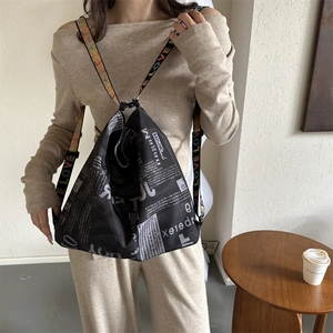 Large capacity newspaper print tote bag with colorful LOVE rainbow shoulder strap
