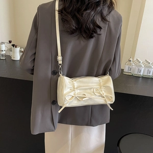 Chic beige pleated shoulder bag with satin finish and cute bows for women fashion