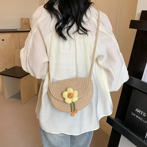 Straw woven saddle bag with yellow flower and long strap for beach vacation