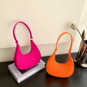 Pink and orange hobo shoulder bags with crocodile texture and gold hardware details