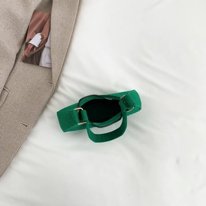 Green textured felt underarm bag with gold hardware shown from an overhead perspective