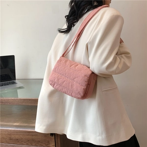 Pink quilted crossbody bag for women made of lightweight padded nylon with shoulder strap