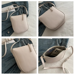 Detailed views of beige lychee texture shoulder bag with zipper and inner card slots