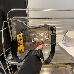 Transparent black PVC crossbody bag with yellow strap and 'Fashion Mini Girl' print
