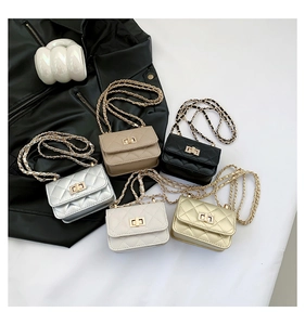 Close-up of stylish quilted mini chain bags in gold, silver, khaki, white, and black colors