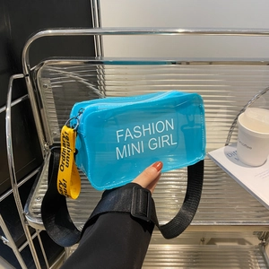 Chic blue transparent mini crossbody bag with yellow strap and bold fashion typography
