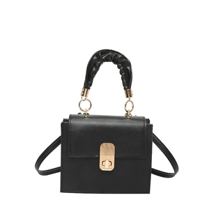 Minimalist black square crossbody bag with pleated handle and golden twist lock closure