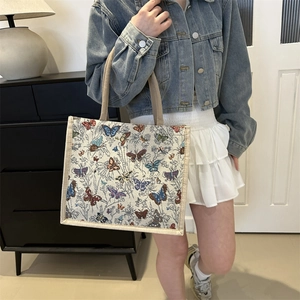 Leuke canvas lunchtas met kleurrijke vlinderpatronen en stevige handvaten voor werk