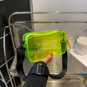 Neon green transparent PVC mini square bag with a black wide adjustable strap