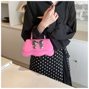 Pink wavy edge handbag with silver bow buckle and elegant chain shoulder strap