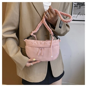 Pink half-moon shoulder bag with unique chunky rope strap and smooth satin finish