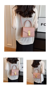 Detailed back and side views of a pink crossbody bag with gold rectangular metal lock