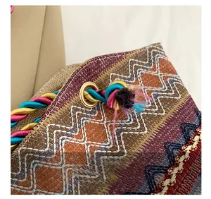 Detail of bohemian tote bag showing colorful woven fabric and premium gold metal hardware