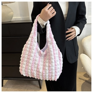 Detail showing pink and white popcorn texture pleated fabric of the large tote bag