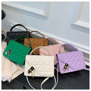 Detail shot of mini crossbody bags in six colors with quilted texture and gold chain locks