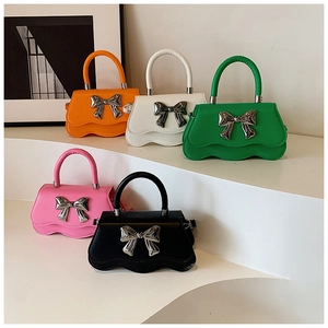 Elegant wave-edge handbags with metal bow buckles in five colors and chain straps