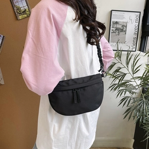 Minimalist black crescent moon nylon crossbody bag with wide woven strap for women