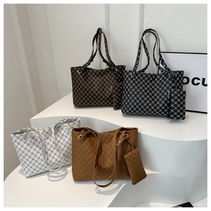 Detailed group view of large capacity tote bags with geometric patterns in four colors