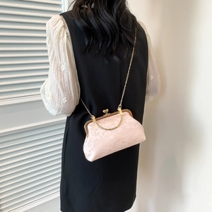 Pink floral jacquard crossbody kiss-lock bag with gold chain and ring handle