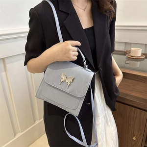 Light blue minimalist handbag with gold butterfly buckle for women's daily fashion style