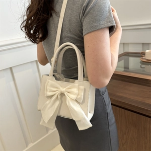 Sac bandoulière blanc élégant avec grand nœud et poignées en cuir pour femme