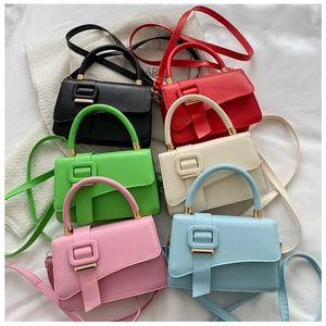 Detailed overhead view of minimalist PU leather crossbody bags in six vibrant colors