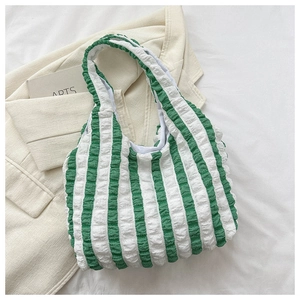 Detail of green and white striped popcorn fabric tote bag with unique bubble texture