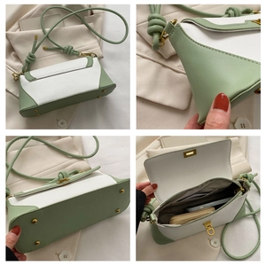 Detailed views of the two-tone baguette bag featuring metal feet and interior pocket