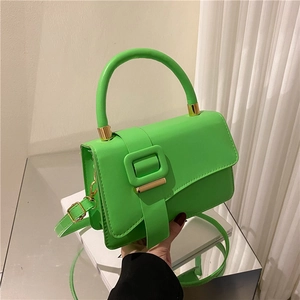 Bright green minimalist square handbag with large buckle and gold-tone metal hardware