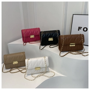 Detail of five quilted crossbody bags with gold clasps and leather chain straps