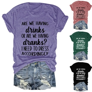 Collage of crew neck slogan T-shirts in purple, red, green, and black colors