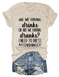 Flat lay of casual crew neck T-shirt with text paired with distressed denim shorts