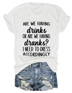 Flat lay of a white crew neck T-shirt with funny slogan and distressed denim shorts