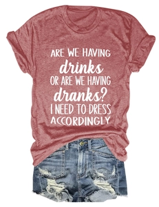 Detail of Are We Having Drinks slogan print on casual brick red short sleeve cotton T-shirt
