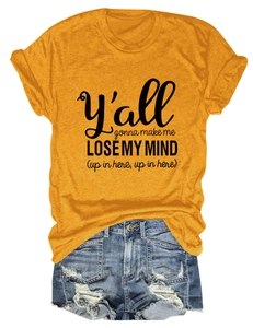 Detail of yellow cotton t-shirt with text print and distressed denim shorts set