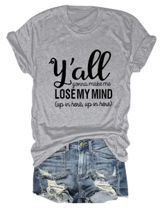 Flat lay of gray cotton T-shirt with 'Lose My Mind' text and distressed denim shorts