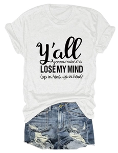 Flat lay of a white crew neck T-shirt with black text and distressed blue denim shorts