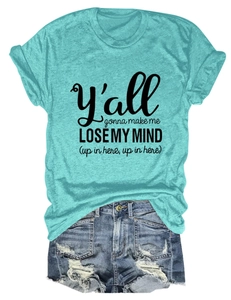 Flat lay of teal crew neck t-shirt with black letter print and distressed denim shorts
