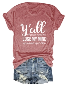 Detail of brick red cotton t-shirt with graphic text and distressed denim shorts flat lay