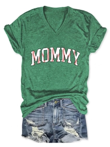 Detail view of green V-neck T-shirt with MOMMY baseball print and denim shorts set