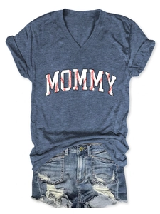 Flat lay of a navy blue V-neck t-shirt with MOMMY print and ripped denim shorts