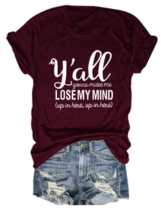 Flat-lay view of burgundy cotton T-shirt with white lettering and denim shorts