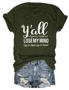 Flat lay of dark green crew neck T-shirt with white text and distressed denim shorts