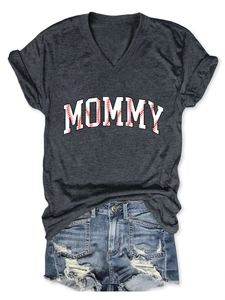 Flat lay of gray V-neck T-shirt with MOMMY baseball print and distressed denim shorts