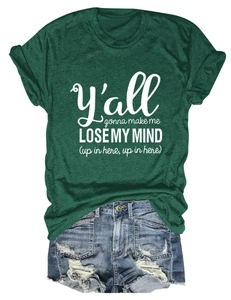 Flat lay of a green casual T-shirt with text and distressed denim shorts for women