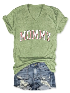 Detail of V-neck mommy t-shirt with baseball texture print and distressed denim shorts