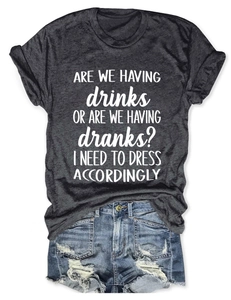 Detail of dark gray heather t-shirt with white lettering paired with denim shorts