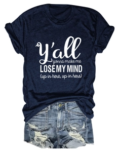 Close-up of navy cotton t-shirt with white text and distressed light blue denim shorts